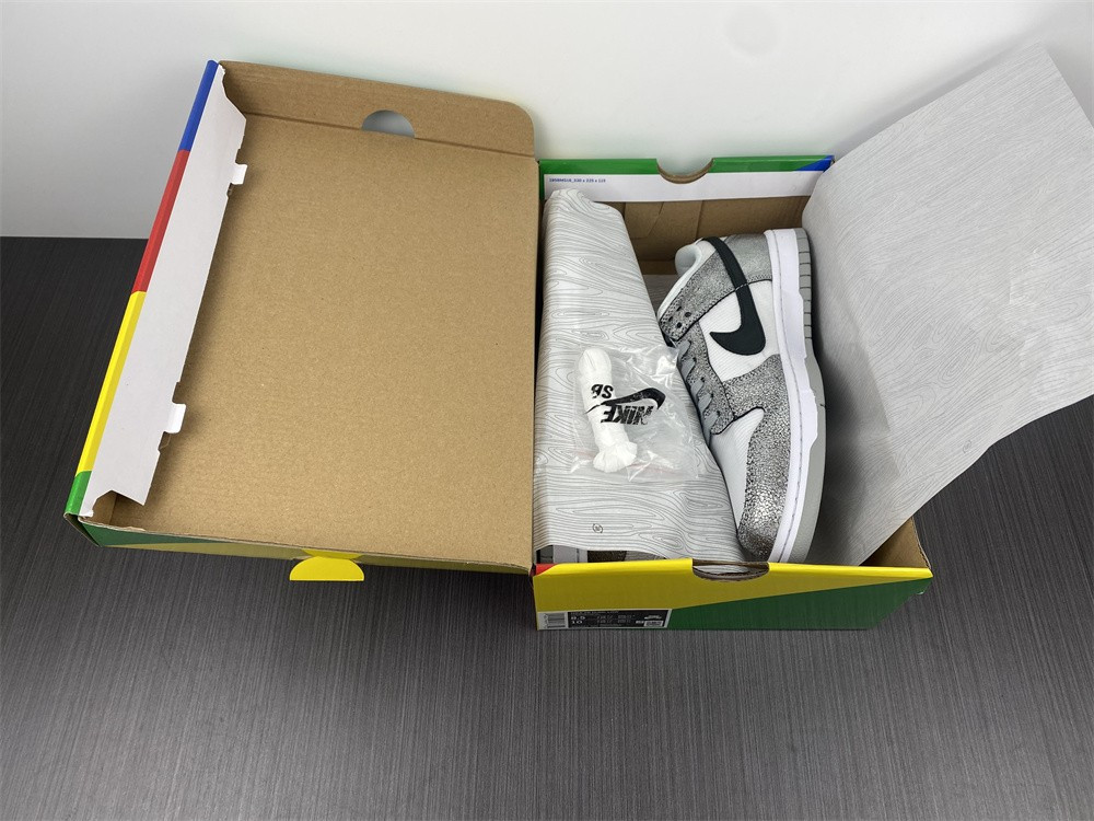 the nike dunk low features silver cracked leather do5882-001
