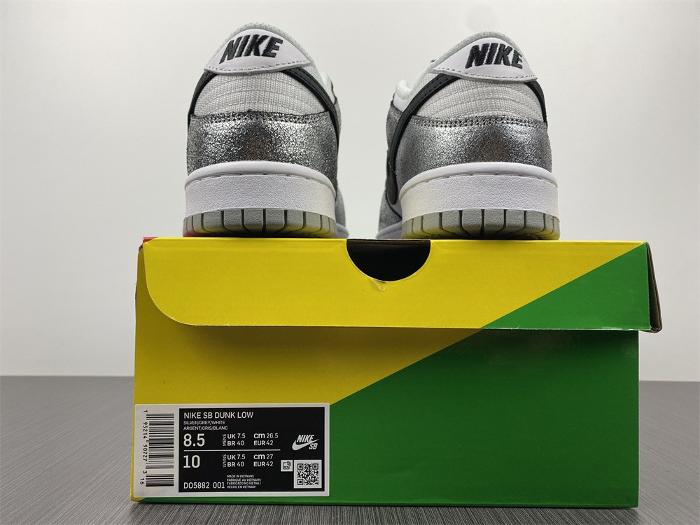 the nike dunk low features silver cracked leather do5882-001