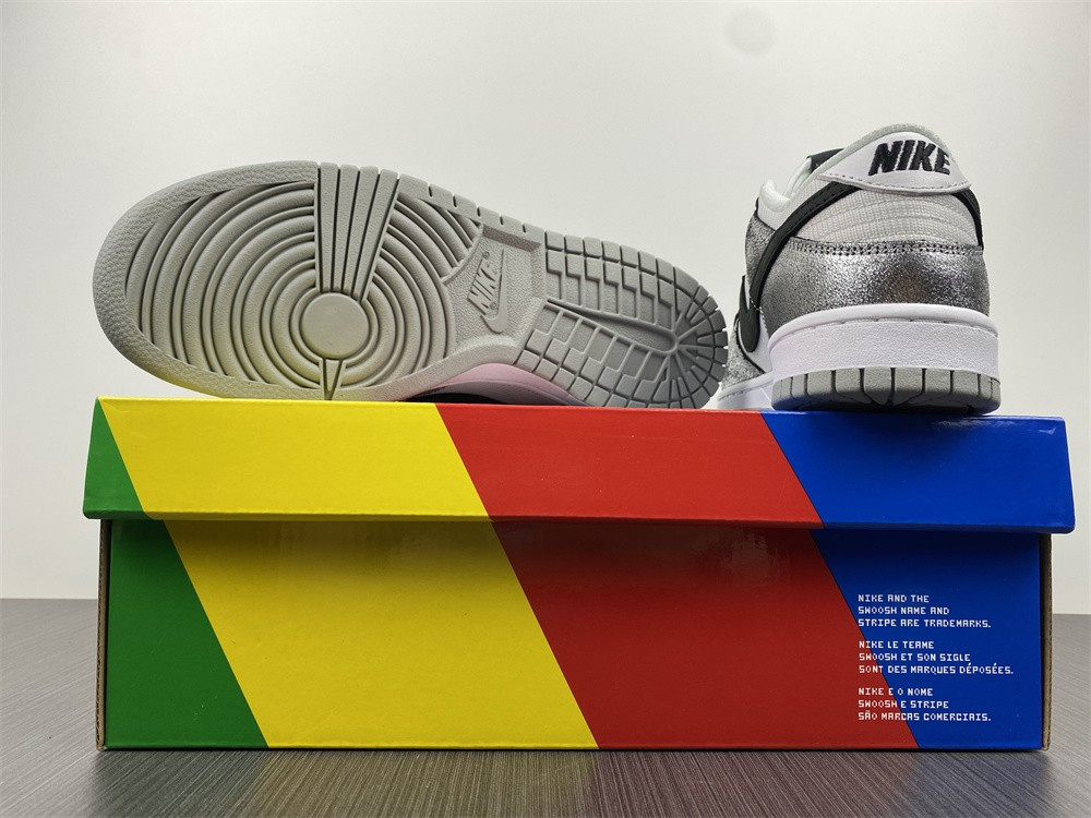 the nike dunk low features silver cracked leather do5882-001